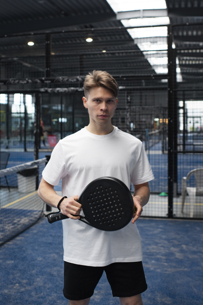 person-getting-ready-play-paddle-tennis-inside-2.jpg
