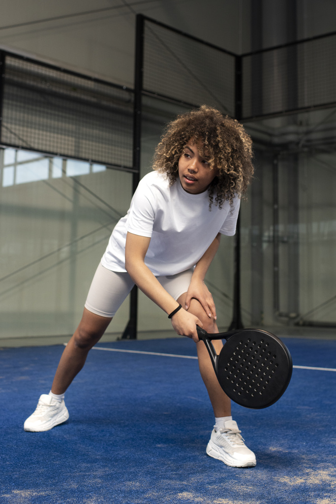 person-getting-ready-play-paddle-tennis-inside.jpg